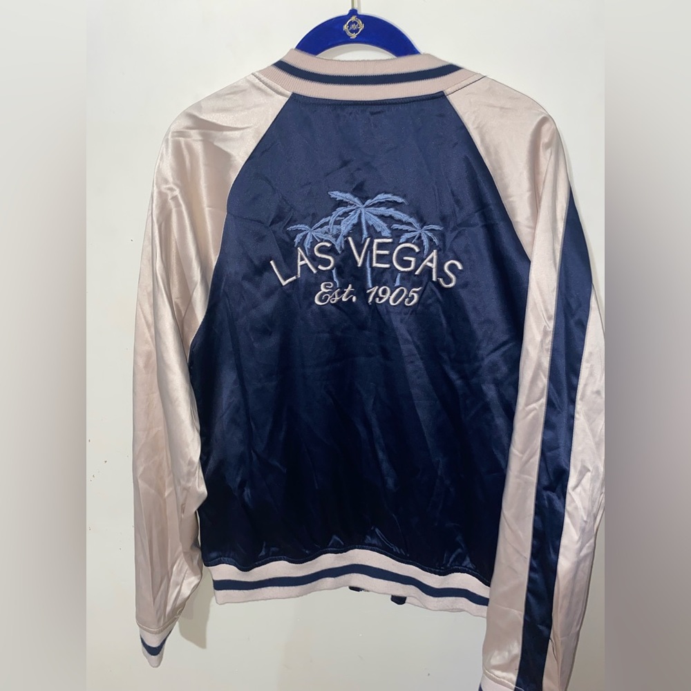 Pink and navy blue jacket. Bought from a Vegas boutique.